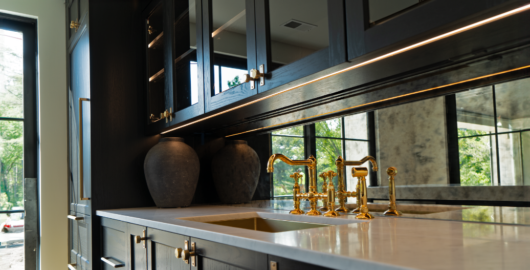 Dark kitchen cabinets with under cabinet lighting