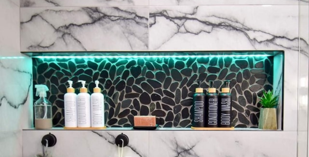Teal shower niche lighting