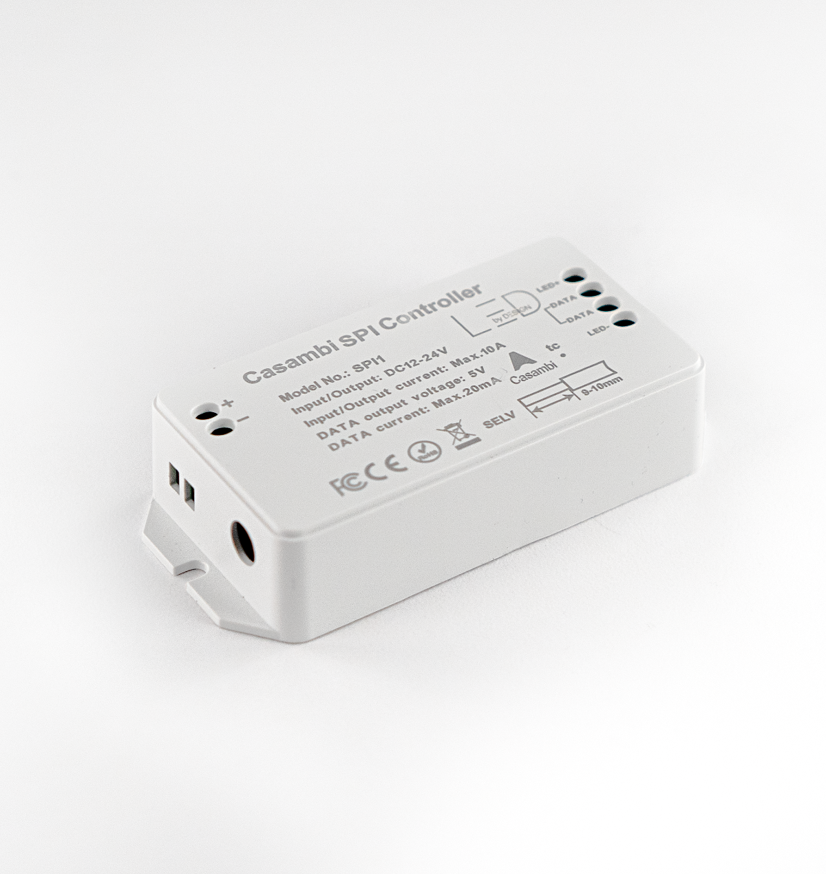 White electronic component with text and symbols on a white background