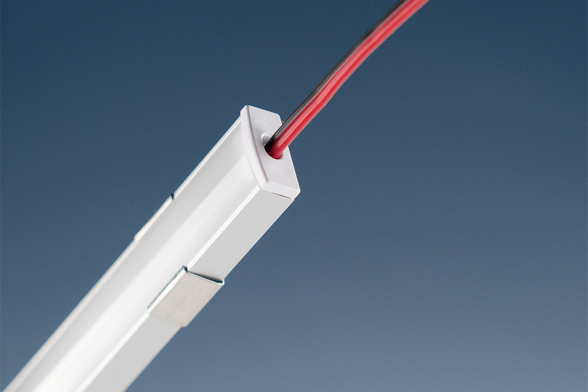LED light bar with a red wire on a blue background