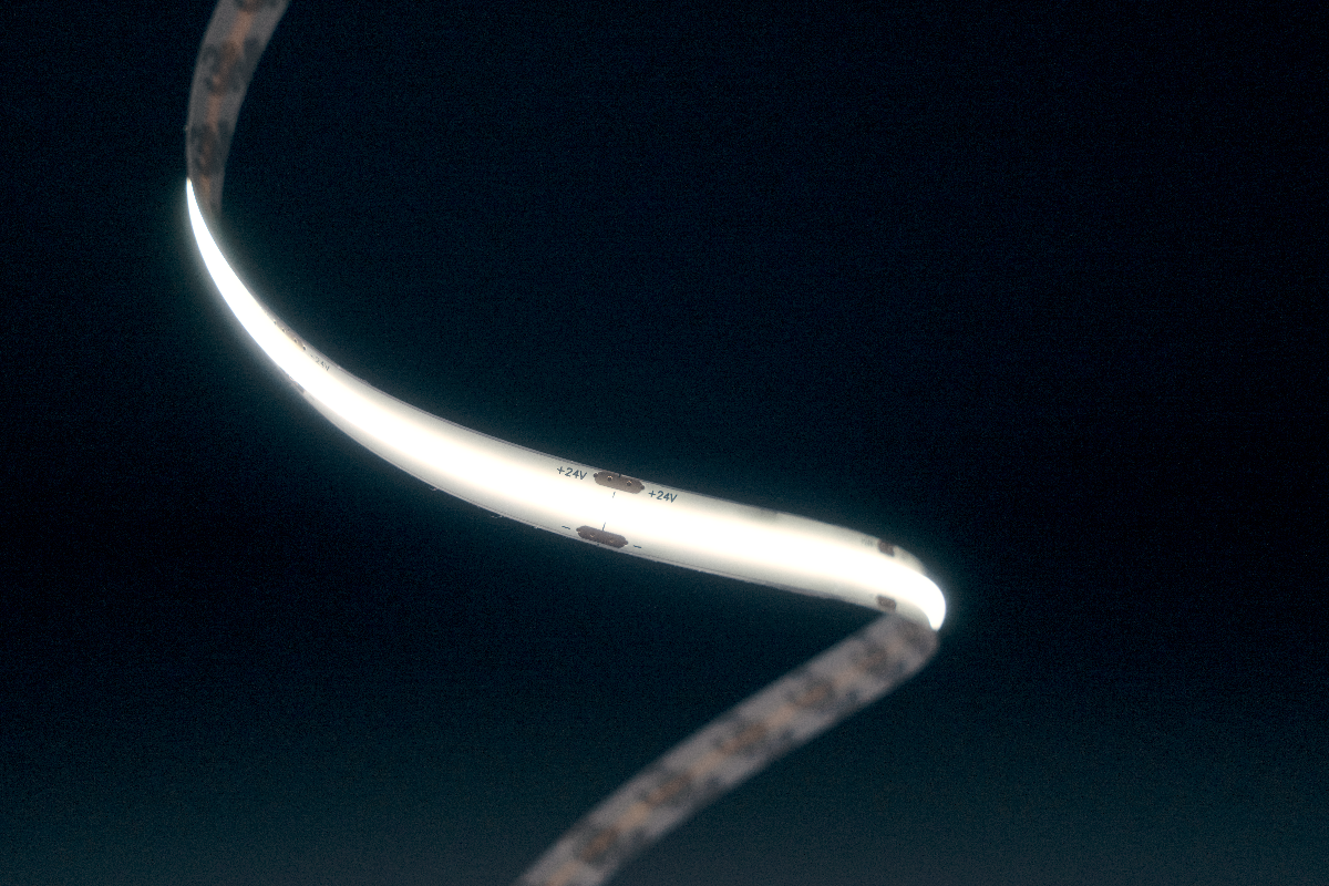 Curved LED light strip on a dark background