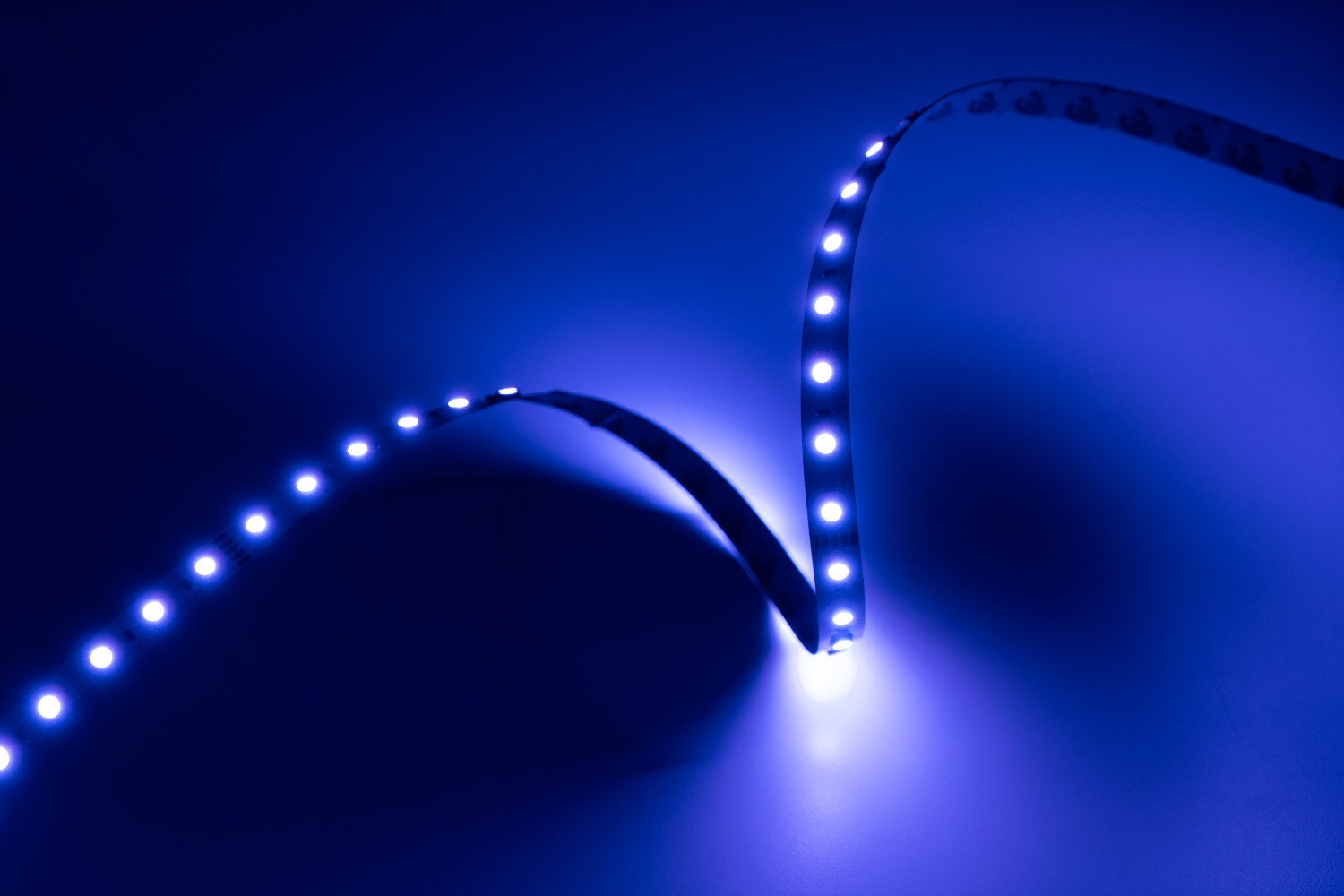 LED strip light emitting blue light on a dark background