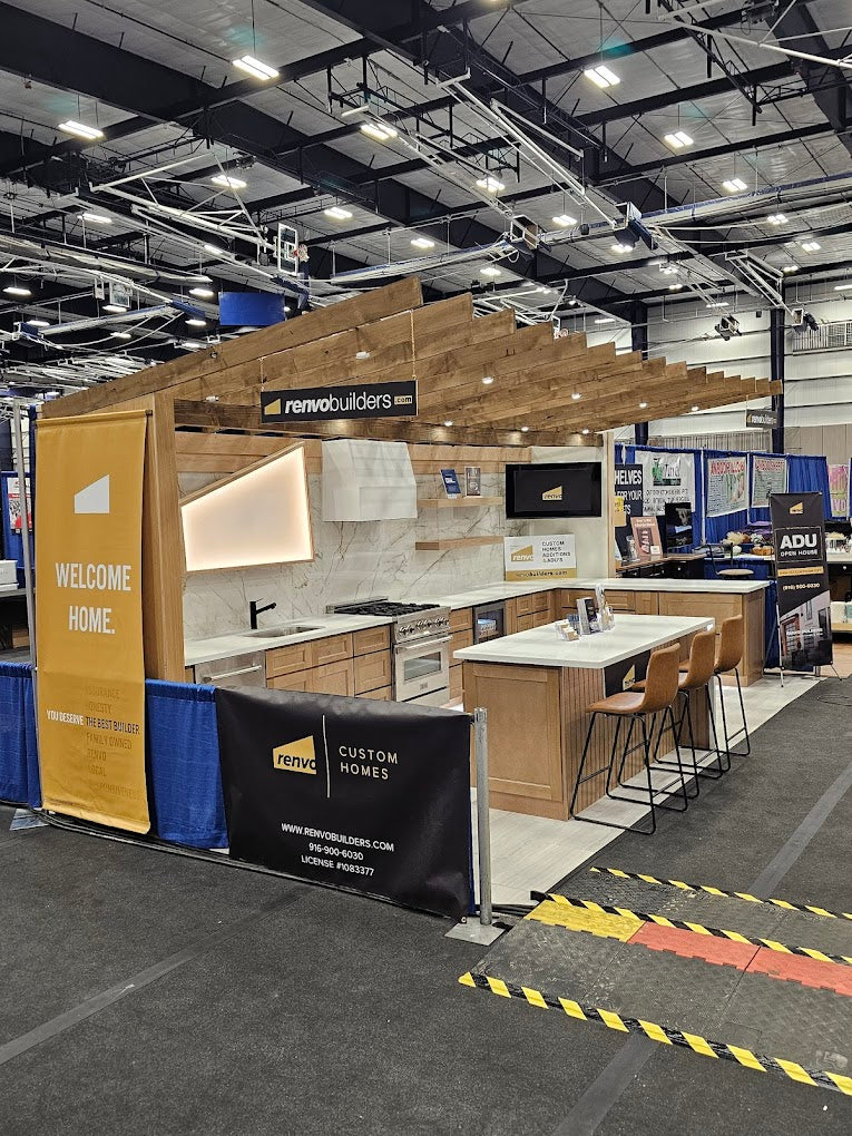 Revolbuilders booth with a kitchen display at an exhibition