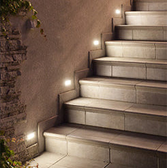 Staircase with embedded lights on a concrete wall