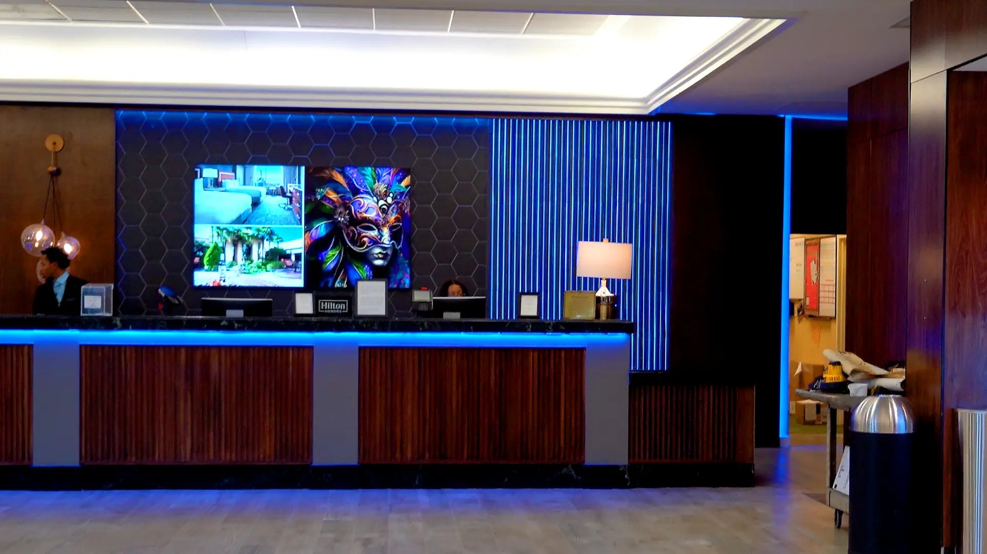 Modern hotel reception area with backlit tile.