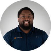 Man wearing a navy blue shirt with aspectLED logo on a gray background